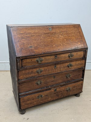 Lot 2269 - An 18th century oak bureau, the fall front...