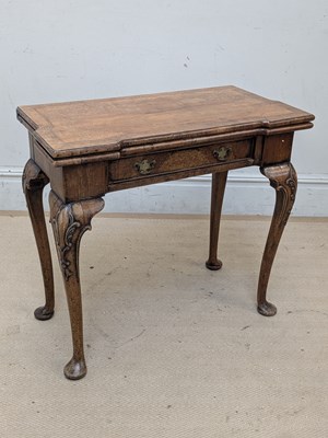 Lot 2103 - An 18th century walnut foldover card table, on...