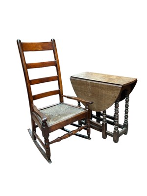 Lot 2279 - A 19th century rush seated country rocking...
