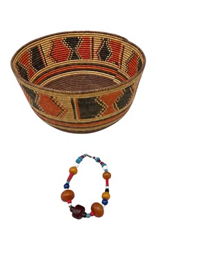 Lot 679 - A large modern Sudanese wicker bowl, diameter...