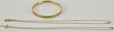 Lot 1136 - A 9ct yellow gold bronze core bangle, with...