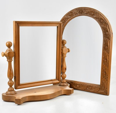 Lot 2294 - A modern carved pine arched mirror, decorated...