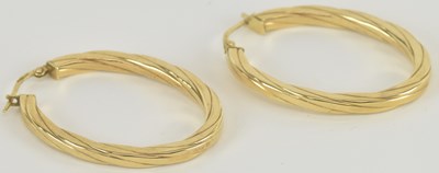 Lot 1266 - A pair of 9ct yellow gold oval hoop earrings,...