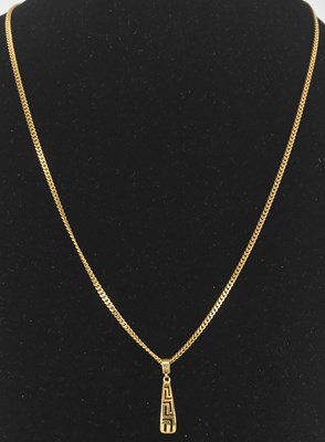 Lot 1232 - A 14ct yellow gold Egyptian type pendant,...