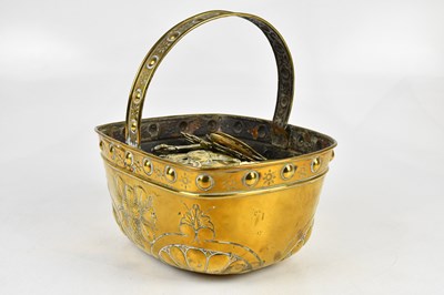 Lot 1394 - A Continental brass swing handled basket, with...