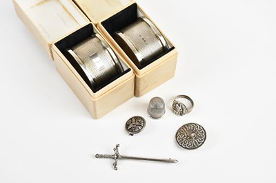 Lot 1570 - A pair of boxed hallmarked silver napkin rings,...