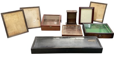 Lot 307 - A modern rectangular ebonised tabletop display...