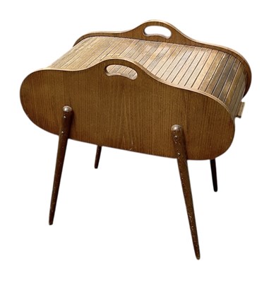 Lot 52 - A retro mid century sliding tambour topped...