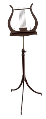 Lot 54 - An Edwardian mahogany music stand, with lyre...