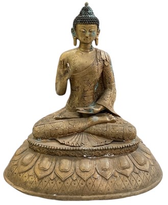 Lot 642 - An early 20th Chinese gilt metal figure of...