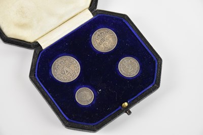 Lot 2564 - An Edward VII silver four piece Maundy Money...