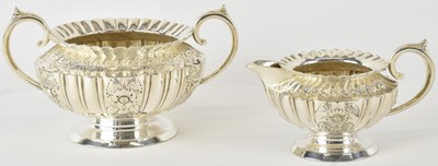 Lot 1028 - A late Victorian white metal twin handled...