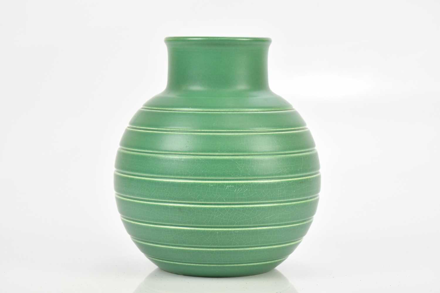 Lot 388 - KEITH MURRAY FOR WEDGWOOD; a green glazed...