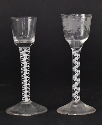 Lot 566 - Two Georgian air twist stem glasses, one with...