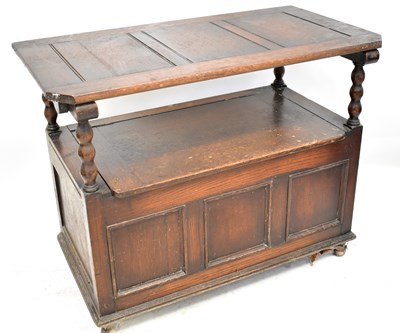 Lot 48 - A 1930s oak monk's bench, with panelled back...