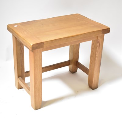 Lot 4 - A modern oak side table, on square legs united...