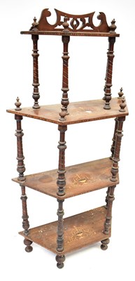 Lot 65 - An Edwardian inlaid walnut four-tiered whatnot...