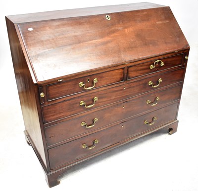 Lot 110 - A George III mahogany bureau, the slope above...