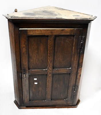 Lot 82 - A 19th century oak corner cupboard, with...