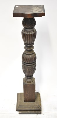 Lot 60 - A carved and stained wooden jardinière stand,...