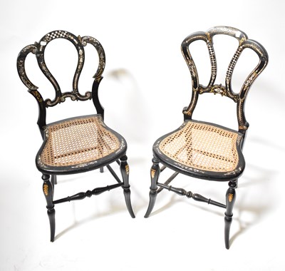 Lot 55 - Four Victorian ebonised and inlaid cane seated...