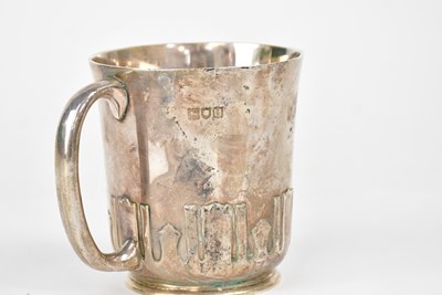 Lot 913 - A George V silver Christening mug, with Arts...