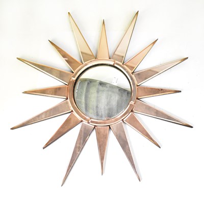 Lot 134 - A 1930s peach and clear glass sunburst wall...
