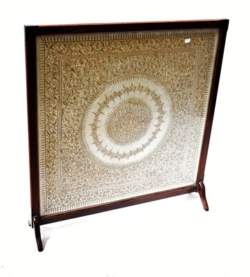 Lot 72 - An oak glazed firescreen with a silk gold...