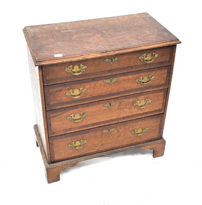Lot 105 - A George III crossbanded oak chest of small...