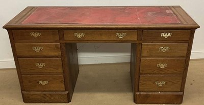 Lot 687 - ALBERT OAKROYD; a nine drawer oak twin...