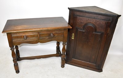 Lot 1650 - An 18th century oak hanging corner cupboard