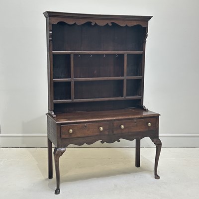 Lot 1025 - A late 18th century oak dresser, with boarded...