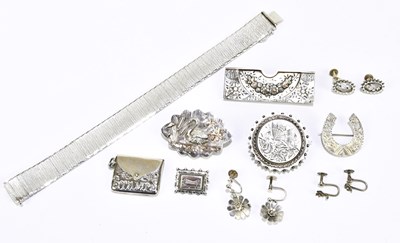 Lot 1554 - A small group of silver and white metal,...