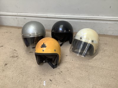 Lot 2017 - Four vintage open-face motorcycle helmets.