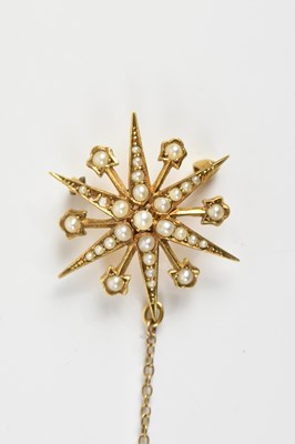 Lot 1601 - A Victorian yellow metal seed pearl star...