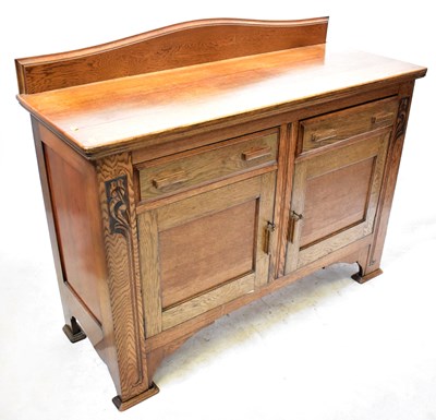 Lot 79 - An early 20th century oak sideboard, with...