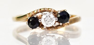 Lot 1029 - A 9ct yellow gold ring set with a central...