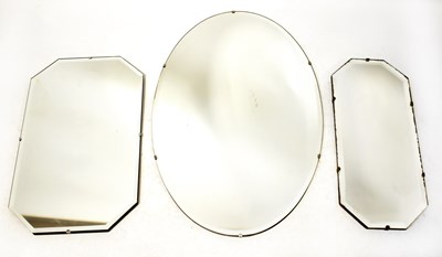 Lot 132 - Three frameless bevelled edge mirrors, the...