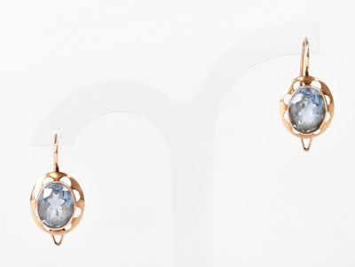 Lot 1365 - A pair of 14ct yellow gold earrings set with...
