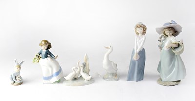 Lot 446 - A Lladró model of a child wearing a bunny suit...