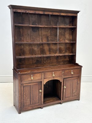 Lot 1026 - An early 19th century Welsh oak dresser, with...