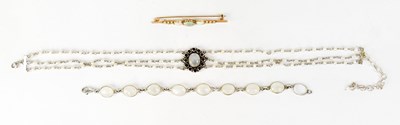 Lot 1112 - A yellow metal bar brooch set with oval opal...
