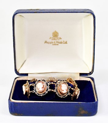 Lot 1046 - A 9ct yellow gold bracelet set with seven oval...