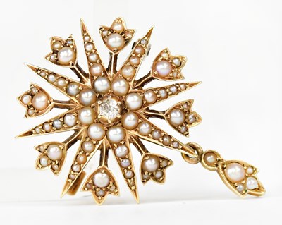 Lot 1062 - A yellow metal star-shaped brooch/pendant set...