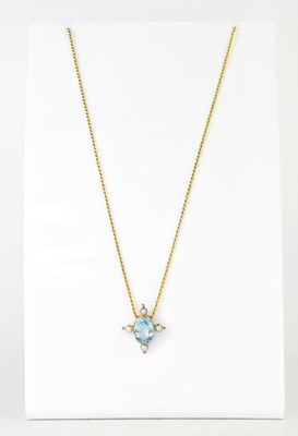 Lot 1083 - A yellow metal pendant set with a faceted oval...