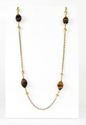 Lot 1078 - A 9ct yellow gold chain and beaded necklace...