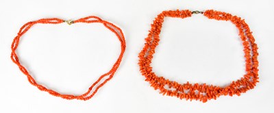 Lot 1094 - Two vintage double-strand beaded coral...