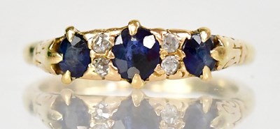 Lot 1023 - An 18ct yellow gold ring set with three...