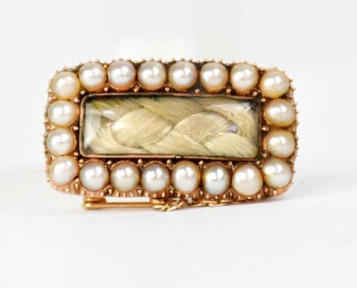 Lot 1061 - A Victorian yellow metal rectangular mourning...