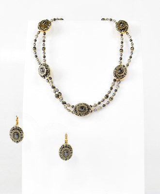 Lot 1124 - MICHAL GOLAN; a gold-coloured double-strand...